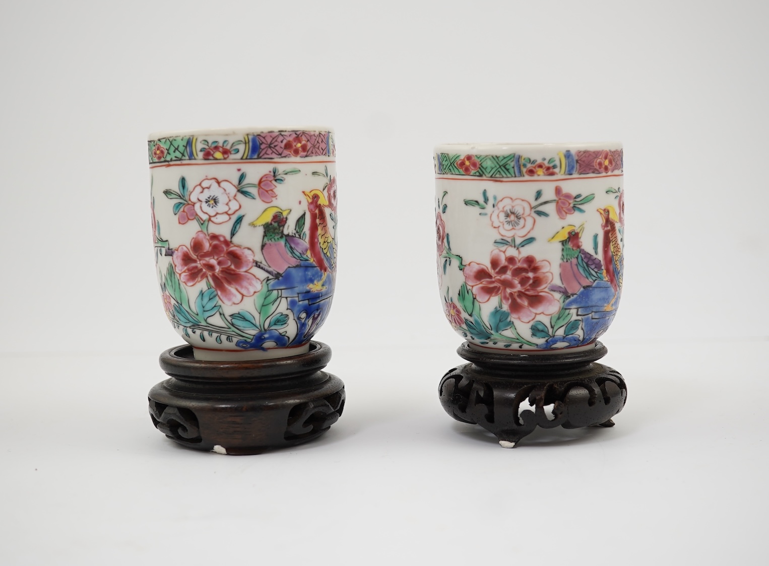 A near pair of Chinese famille rose ‘double pheasant’ coffee cups, early Qianlong period